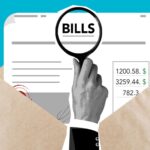 Cutout paper composition of male with magnifier received expensive taxes and payments on blue background